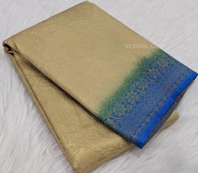 CODE:WS18 Beige soft brocade saree,all over zari woven design,contrast blue double side borders ,rich gold zari woven pallu,with soft blue zari woven brocade blouse