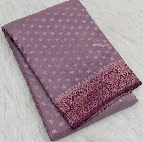 CODE WS329 :  Mauve crepe georgette saree with benarasi woven small  buttas all-over, traditional rani pink short borders on both sides,rich zari woven pallu and plain running blouse with borders