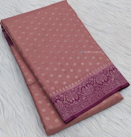 CODE WS332 : Peachish pink crepe georgette saree with benarasi woven small  buttas all-over, traditional violet short borders on both sides,rich zari woven pallu and plain running  blouse with borders