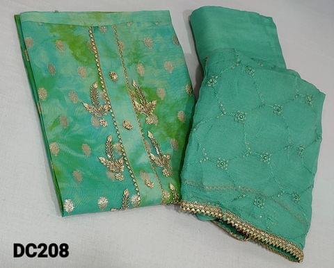 CODE DC208: Designer Turquoise green and golden tint Tissue Silk Cotton Unstitched salwar material (requires lining) with zardozi, sequence work on yoke, zari woven buttas on frontside, matching santoon bottom, thread and sequence work on chiffon dupatta with gota lace tapings.