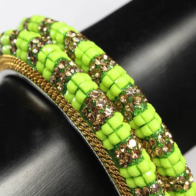 Embossed heightened look shamrock green royal feel fashionable and outstanding feel trendy embellishments and chains twin bangles