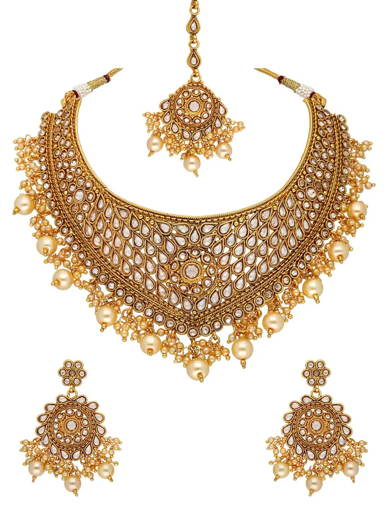 Reverse AD Necklace Set with Maang Tikka in Gold finish - AMN607