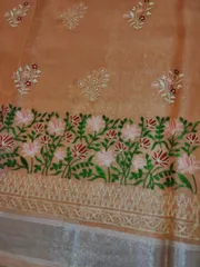 Beautiful banarsi Tissue Silk saree in Melon Orange with Lotus Hand Embroidery and Chikankari work
