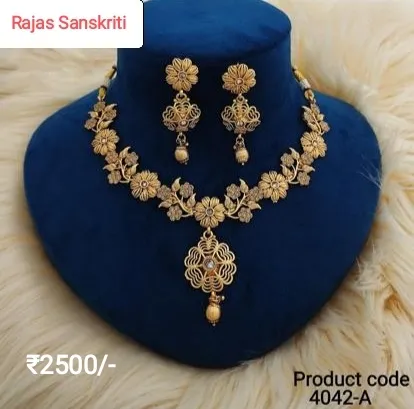 Beautiful and Intricately carved Gold Set with Studded American diamonds