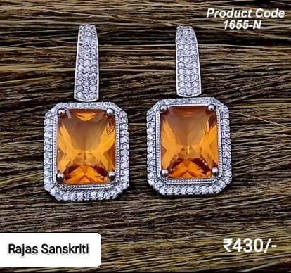 American Diamond Earrings with Fiery Orange Stone studded in Silver Metal