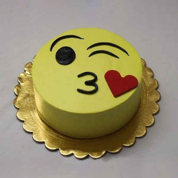 Eggless Pineapple Kiss Emoji Cake