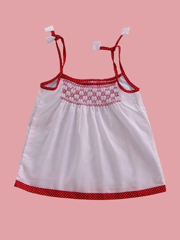 White Frock With Contrast Red Smocking Work